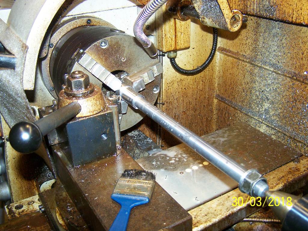 Set up in the lathe c-c and cut down to 26mm and 45mm wide, this is for the swingarm to clamp onto.