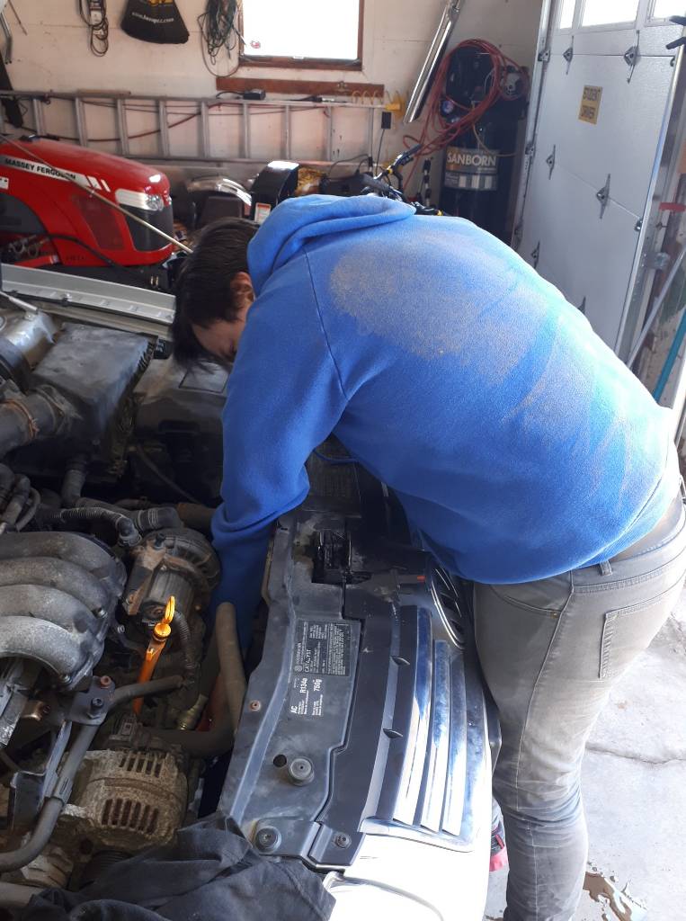 Ben installing the oil filter..