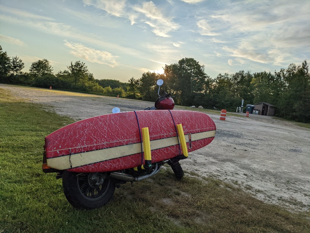 Early morning, parking lot near a local break before the summer tourists stream in - and before pay-to-park rules apply.