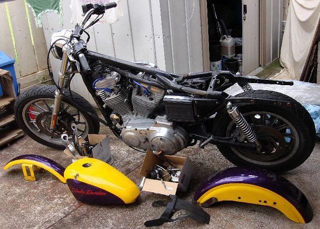 Here she is my first Harley; a 2000 883 Hugger.  I bought it for $1500, after some guy dropped it and tore up the primary case, 