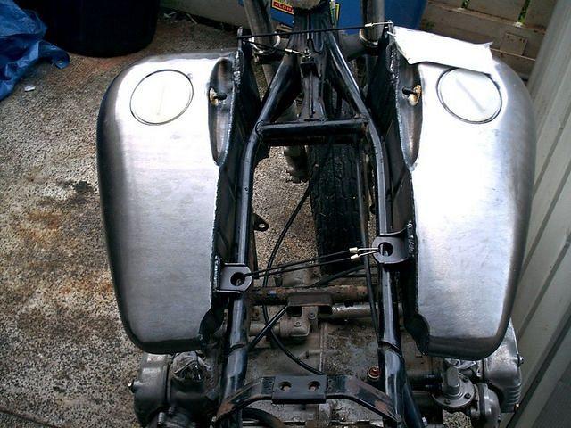 This is what a seven gallon flatside fat bob tank looks like on a wing frame, way too wide!