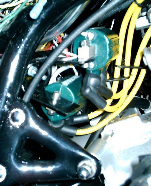 I made a bracket for the Dyna Coils by bending a piece of stout sheet metal and attaching it to the frame.