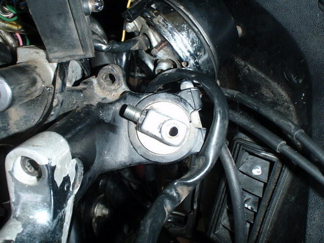 I removed the air valve and hose, and will replace the fluid through the top; it will be easy for the right tube...
