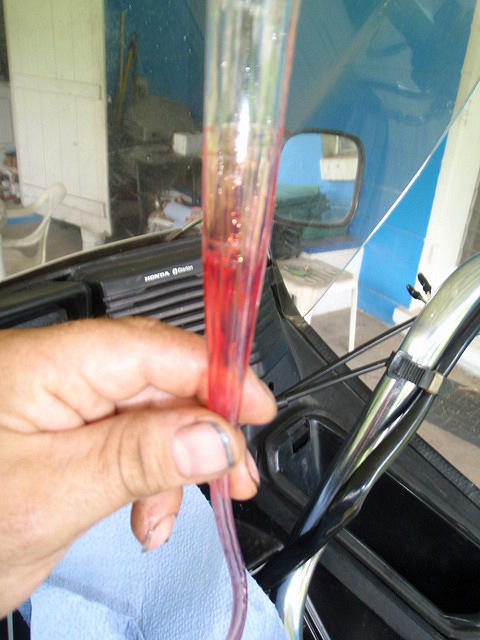 Compress the fork, and air bubbles come out...