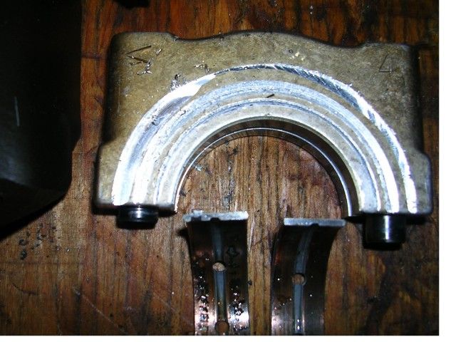 Bearing_Cap_with_Rub_Marks.jpg

Here is a bearing cap showing scraping from the bent crank.  This is were the aluminum shaving