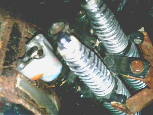 Cushman riser use, bolted to top of HD fork to mount bars Treaded plugs welded in top of springer