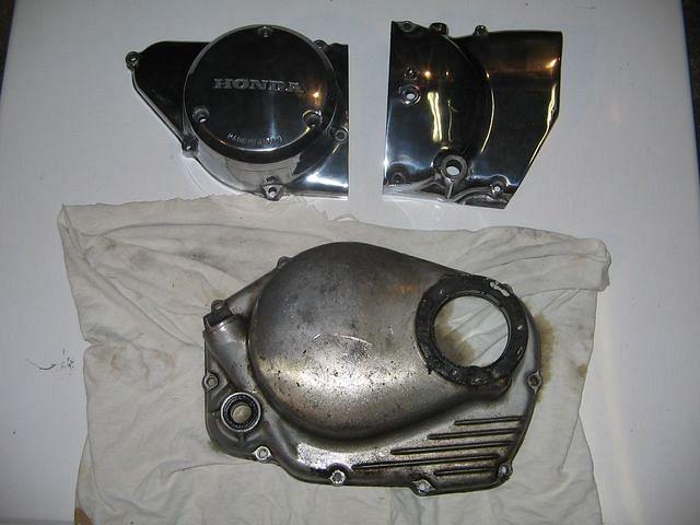 Both CL350 sidecovers, one finished, the other in its original condition.