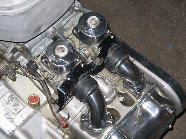 Just getting started on the engine, I am changing out the OEM hex head hardware for the black allen. I like the industrial look.