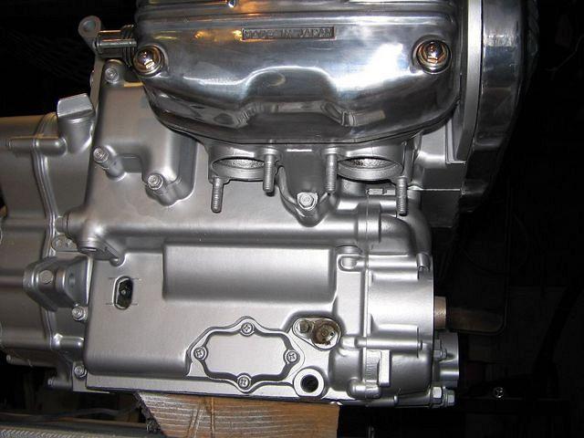 Making sure all areas on engine are coated well