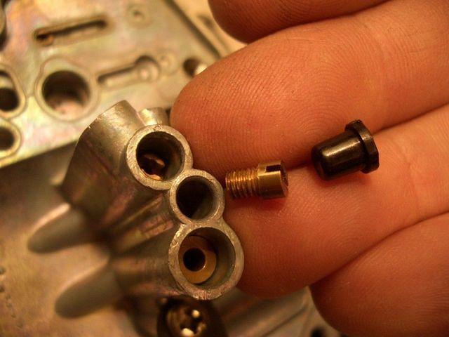 Slow jet and rubber cap. 
It should read "35".
NOTE:
The Clymer Manual has
got the position of this rubber cap
 W