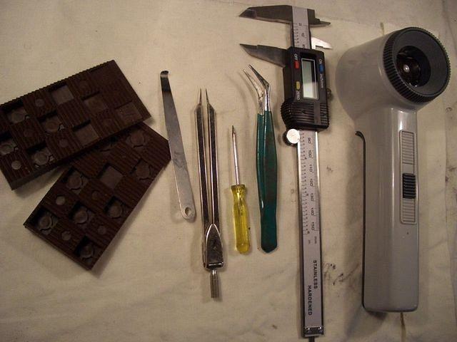 Some tools I've found usefull.
Wedges
A feeler-gauge heated and bend
for adjusting float level
A pair of dividers to remove 