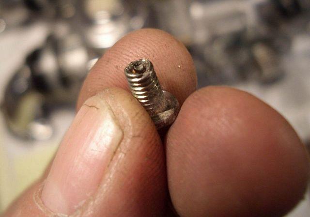 It's impossible to see from the photo but;
from new the last bit of the screw is hollow and has a very small slit,
that has pr