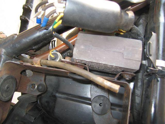 This picture will probably be of NO USE during reassembly.  But it does show that the stator wire connector probably burnt up an