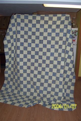 Had some yellow left over from the other quilt, used a different blue/yellow plaid ...is called nine patch ...hahaha i know i kn