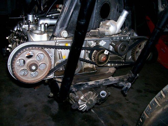New timing belts in place. You can see the tape I used to mark the crankshaft. The shop manual was increadibly valuable for work