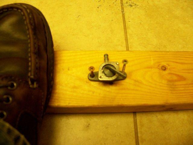 Petcock started to leak. Screwed it to a 2x4 to follow Randakk's prodceedure.