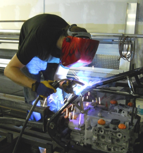 CHRIS WELDING IN ONE OF TWO NEW ONE INCH TUBE STEEL GUSSETS CHRIS CROSS AS ROBIN RECOMMENED