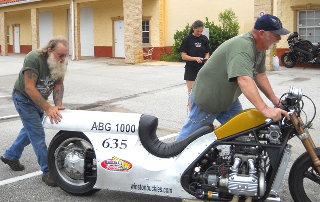 HONDA JOE WITH WINSTON AND KELLY TAKING PHOTOS IN THE BACK GROUND