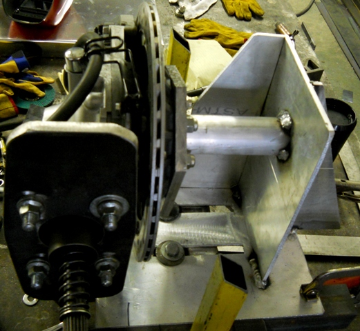 ONE AND A HALF HOURS LATER DANNY HAS A NEW REAR HUB STAND FINISHED AND MOUTED TO THE HUB