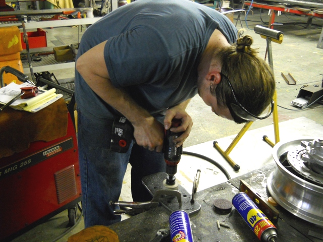 POOR CHRIS GOING THROUGH THREE SNAP ON BATTERY DRILLS TO GET THE WHOLE HALF DRILLED  DANNY MADE OFF WITH THE GOOD DRILL