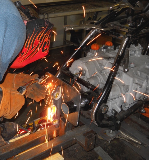 SIMPLE TACK WELDS TO HOLD STEEL PLATE IN POSITION ON SWINGARM
