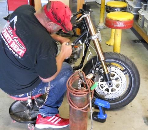 WINSTON AND HIS HACK SAW!   CUTTING OFF RADIATOR MOUNTING BOLTS