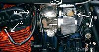 Inline fuel filters, moved the ignition switch here and put some of those flashing spark plug caps on it.