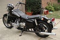 New tires, mufflers, rear lights, new paint, new fatbob tanks, fabbed seat and leather fairing around gas tank.  