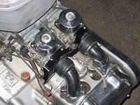 Just getting started on the engine, I am changing out the OEM hex head hardware for the black allen. I like the industrial look.