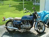 Here she is about a year after I got her... fairing & bags gone, has the "redneck seat" and still has the rusty cr