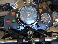 Dashboard. Yellows are blinkers,red is oil,green is neutral,Hi beam indicator on headlight.