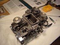 I had lots of trouble getting the
unit off the bike!
I suspect what the manuals says about;
"...just unbolt the manifold