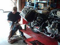 Bike On Table, Mark S. Cleaning The Original Headlight Bucket