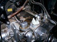 the carbs were disconnected and wedged in here
