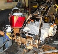 CHRIS WELDING IN THE FINAL GUSSETS TO THE FRONT SWINGARM PLATE
