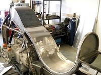 Compartment cover above seat will open to battery and electrical sitting below on top of swingarm front brace