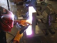 DANNY NOW NICKNAMED THE BADGER DOING WHAT HE LOVES TO DO.  CREATE LIFE FROM METAL!