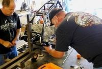 MOUNTING REAR FRAME CLAMPS TO LEVEL FRAME LEFT TO RIGHT AND HOLD STRAIGHT ON LAZER LINE FRONT TO BACK