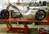 OUR NEW LIFT IN ACTION-IT COVERS THE WHOLE 110 INCH BIKE WITH NEW EXTENTION PUT IN BY CHRIS-NOTE OUR MAIN SPONSOR'S LOGO GLOWING