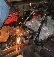 SIMPLE TACK WELDS TO HOLD STEEL PLATE IN POSITION ON SWINGARM